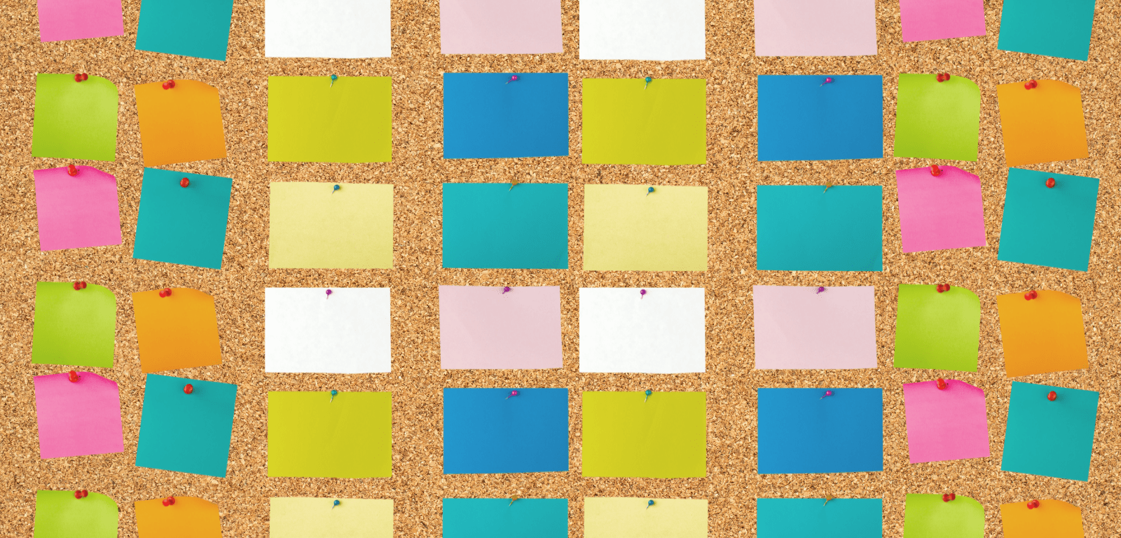 cork board covered with sticky notes