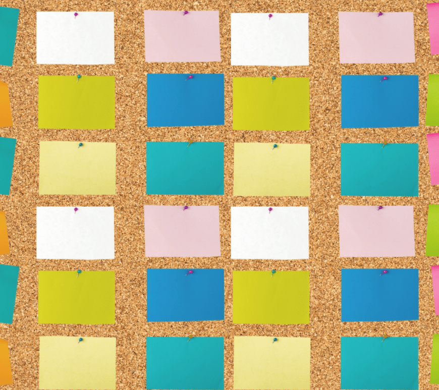 cork board covered with sticky notes